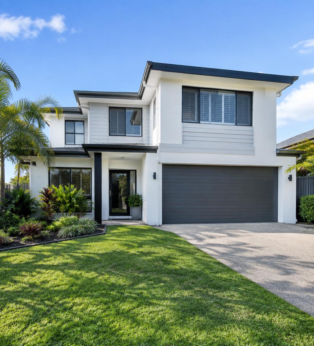 Freshly painted Brisbane home exterior with crisp white walls and dark trim